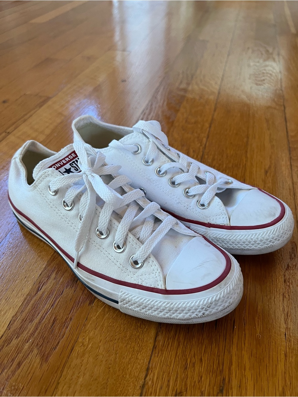 Converse Low Top Canvas Sneakers in White with Red Trim